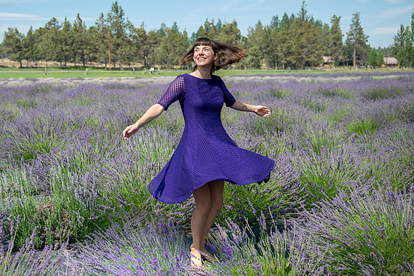 meg twirling and smile